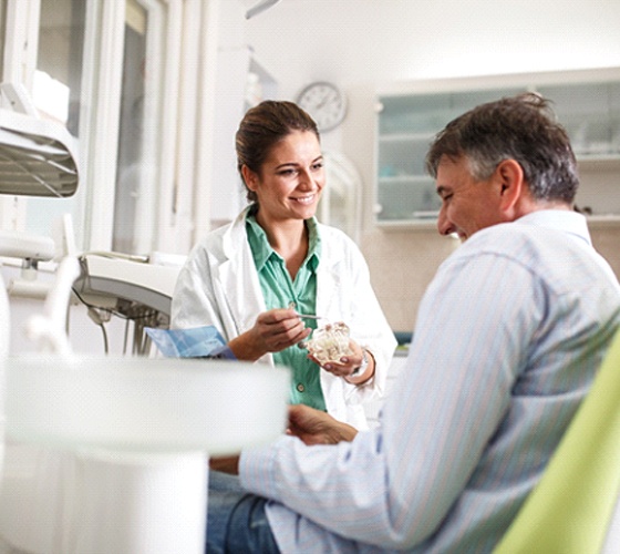 patient and dentist discussing dental implant failure in Lady Lake