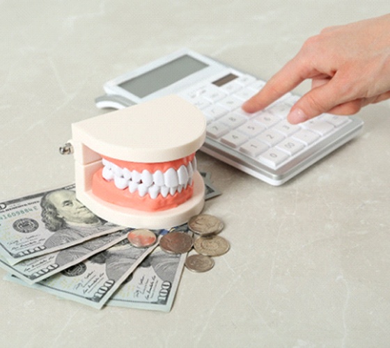 Using calculator to budget for cost of full mouth reconstruction