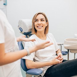 Lady smiles at dentist