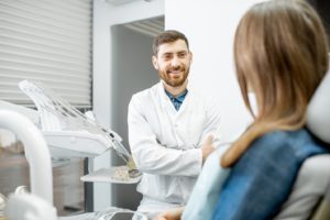 a patient during her dental implant consultation 